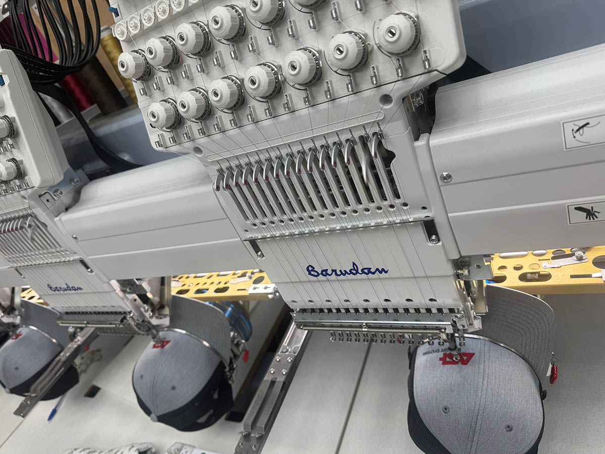 Hats being embroidered