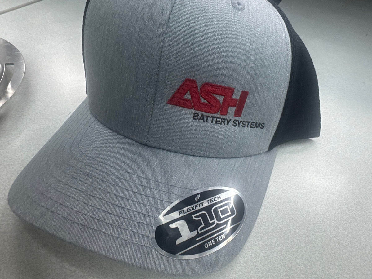 A grey hat with red logo